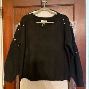 Elegant Black Sweater with Pearl Accents